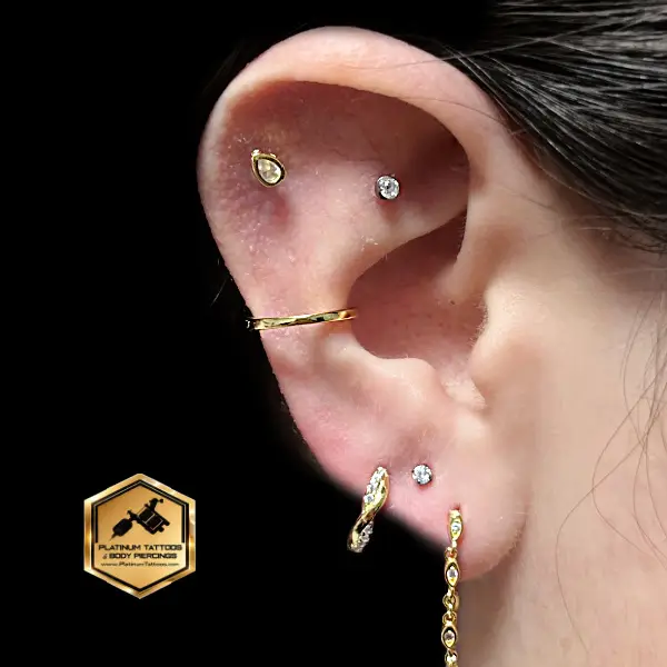 Helix ear piercing performed at Platinum Tattoos & Piercings in San Antonio